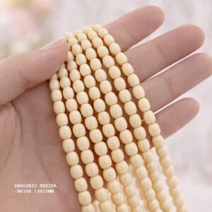 PERLE OVALE EN RÉSINE BEIGE 13×10 MM