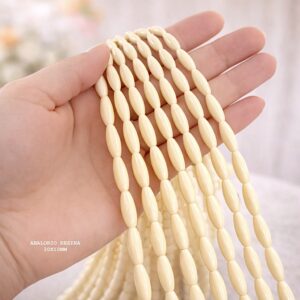 PERLE OVALE EN RÉSINE BEIGE 30×10 MM