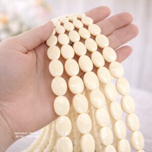 PERLE OVALE EN RÉSINE BEIGE 30×20 MM