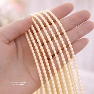 PERLE OVALE EN RÉSINE BEIGE 6×4 MM